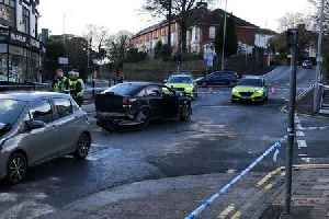 Teenager arrested after four-car crash closes busy city street and leaves man in hospital