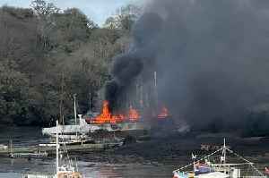 Dramatic photos of Flushing fire as boat goes up in flames