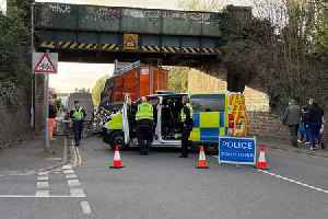 Lorry stuck under Cheltenham bridge