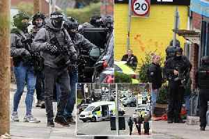 Counter-terror cops in Manchester block off road during ongoing incident