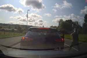 Driver leaves man unconscious after punching him through car window