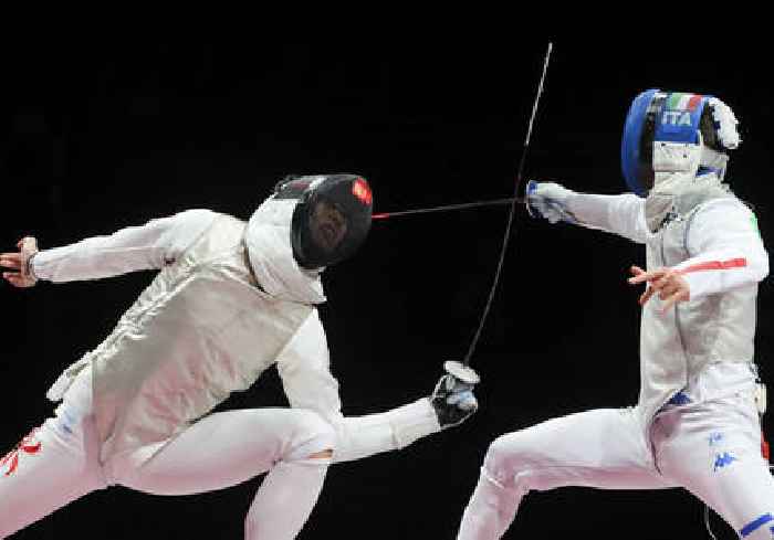 Team USA fencers don pink masks for teammate accused of sexual misconduct