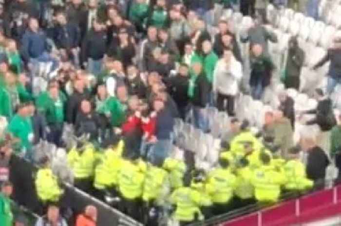 Rapid Vienna fans clash with West Ham supporters and police during Europa League match