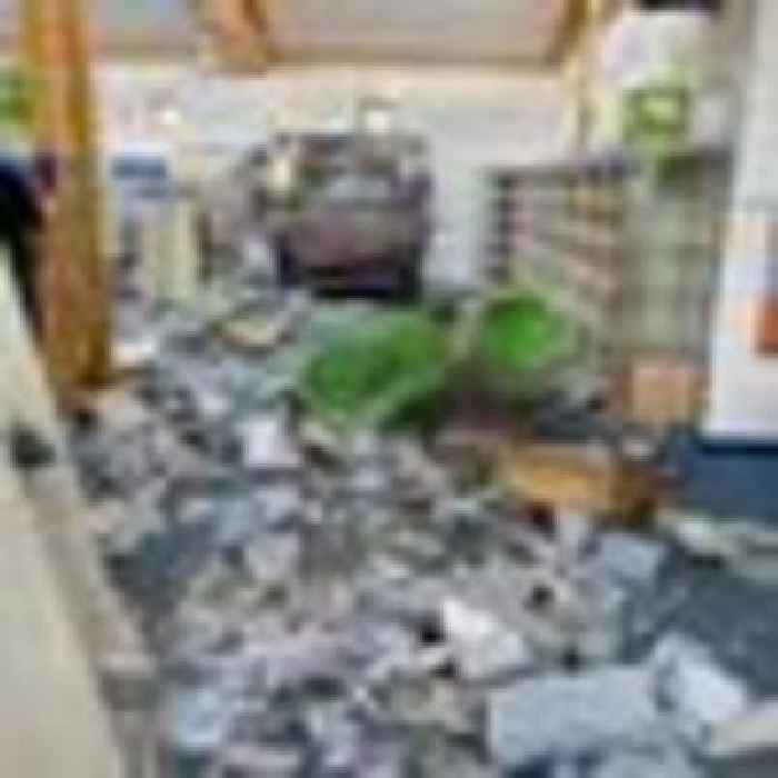 Couple left trapped inside library after car smashes through wall