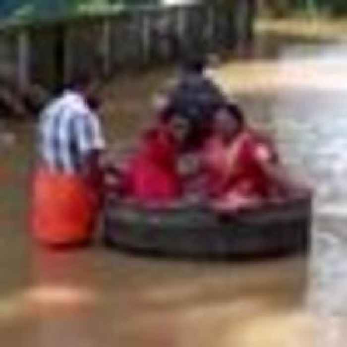 Indian couple sail to their wedding in giant cooking pot in flood-hit Kerala