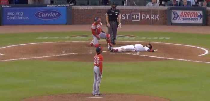 WATCH: Atlanta Braves Catcher Falls to Ground Sarcastically After Being Hit By Slow Ball
