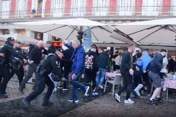 Chelsea and Man City fans fight in Madrid as baton-wielding police storm into brawl