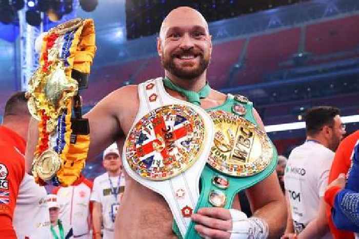 Tyson Fury poses with brand new boxing belt that was introduced for Dillian Whyte fight