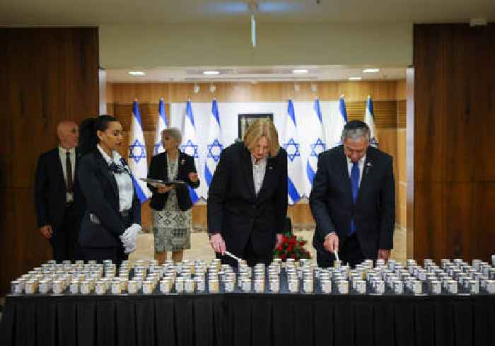 Bundestag president lights memorial candle at Knesset