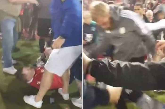 Oli McBurnie appears to stamp on Nottingham Forest fan during post-match pitch invasion