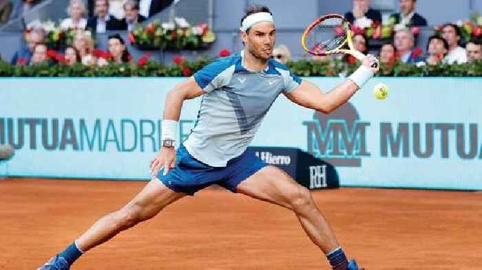 Nadal tests injury in front of packed stands in Paris