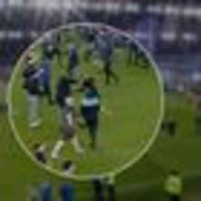 Mass pitch invasions and altercation between Vieira and fan in 'disgusting' night of football clashes