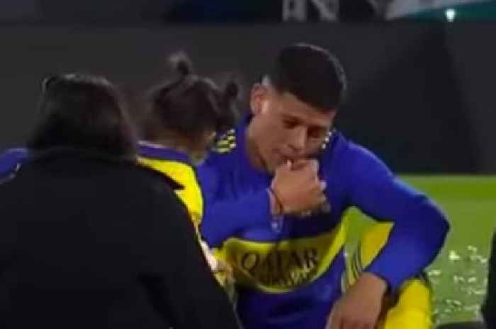 Man Utd flop Marcos Rojo slammed for smoking fag on pitch with family after Boca win