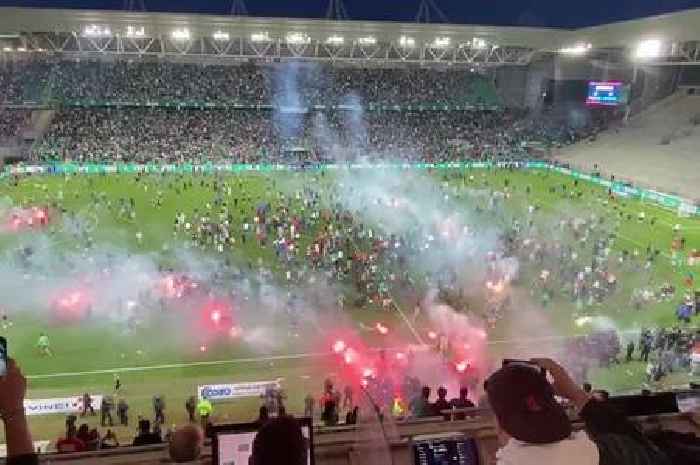 St-Etienne fans chase own players off pitch and launch flares after Ligue 1 relegation