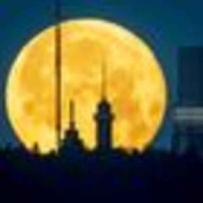 Strawberry supermoon lights up sky around the world - in pictures
