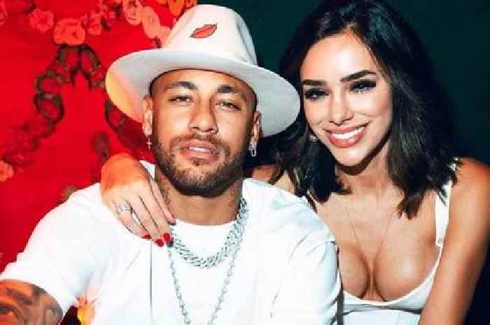 Neymar toasts to girlfriend Bruna Biancardi who poses by his side in very busty display