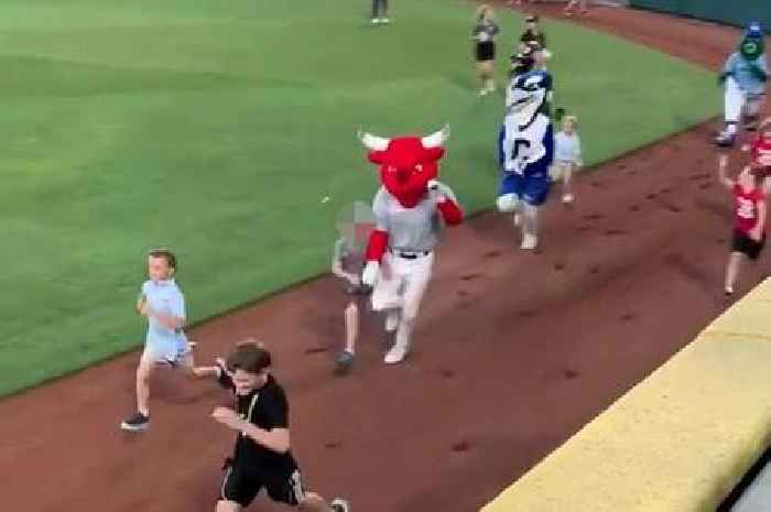 Sports mascot in bull costume tramples boy during race before rival hurdles him