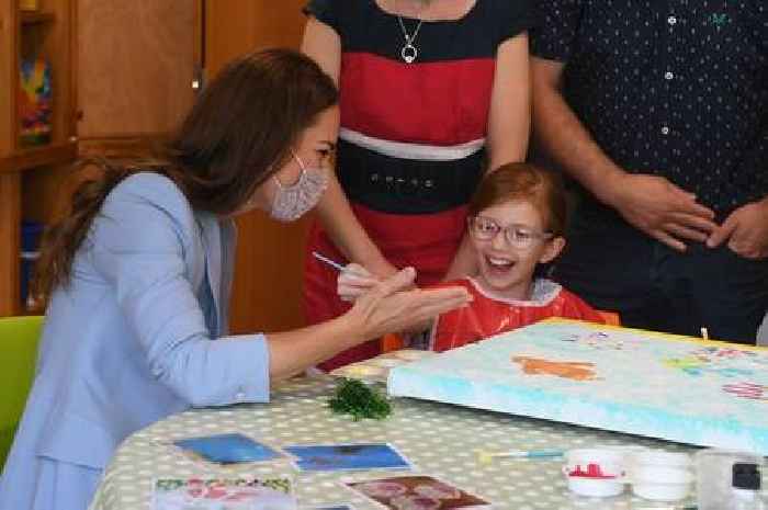 Kate Middleton finger paints with children at EACH on royal visit to Cambridge - photos