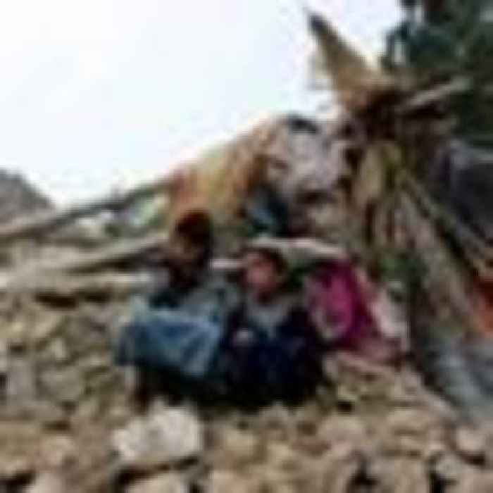 Rescuers dig by hand for quake survivors amid confusion over Taliban aid appeal