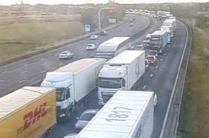 M6 delays of 60 minutes and four-mile queues after crash causes oil spill - updates