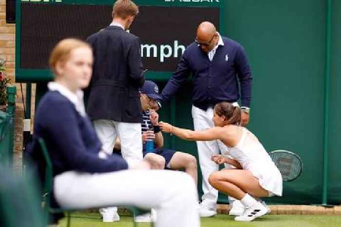 British number five Jodie Burrage gives ballboy Percy Pig sweets after he faints at Wimbledon