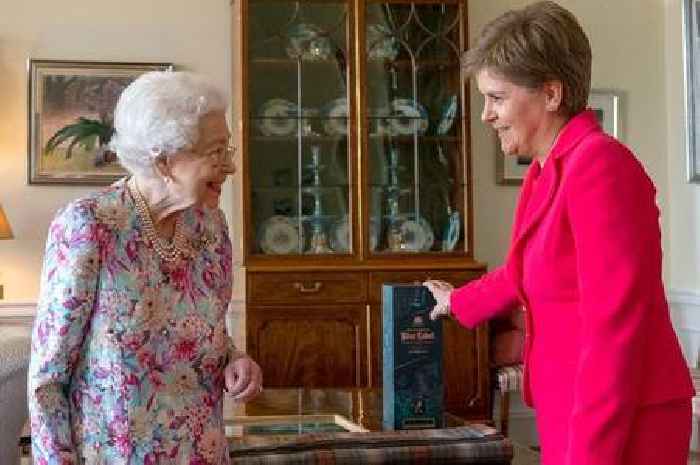 Nicola Sturgeon gifts Queen Elizabeth a bottle of whisky during their meeting in Edinburgh