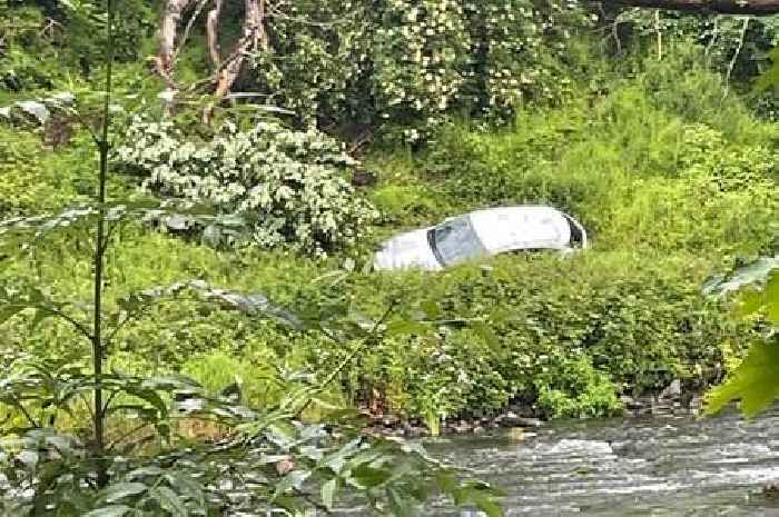 Dramatic pictures show car narrowly escape rolling into river after spinning off Scots road