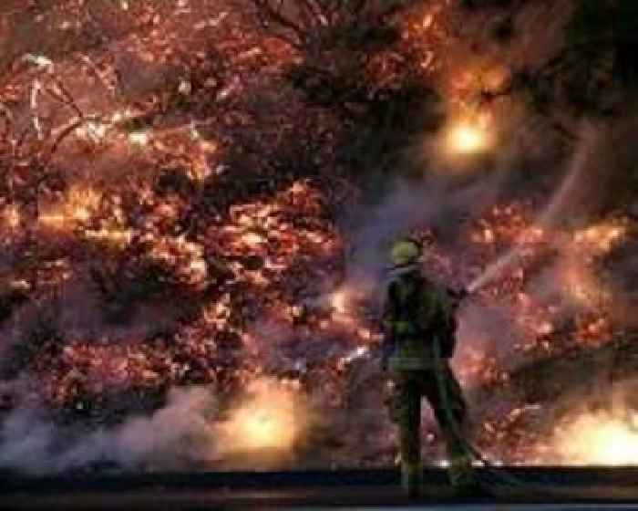 Wildfire rages as California bakes under heat dome