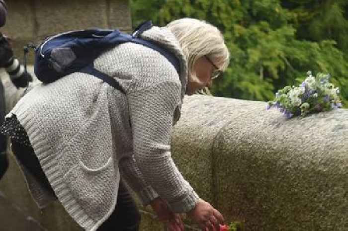 Floral tributes to The Queen left at Balmoral Castle as tearful mourners gather at gates