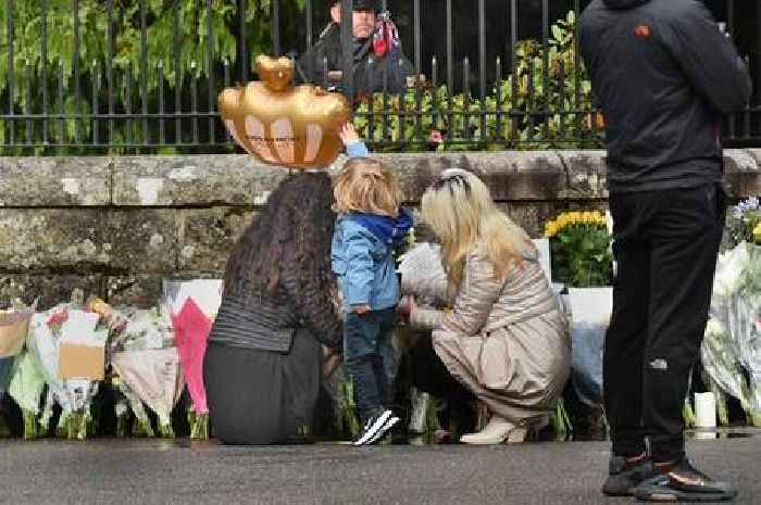 Tearful mourners line gates of Balmoral Castle with tributes for Queen