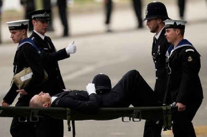 Police officer rushed away on stretcher during Queen's funeral