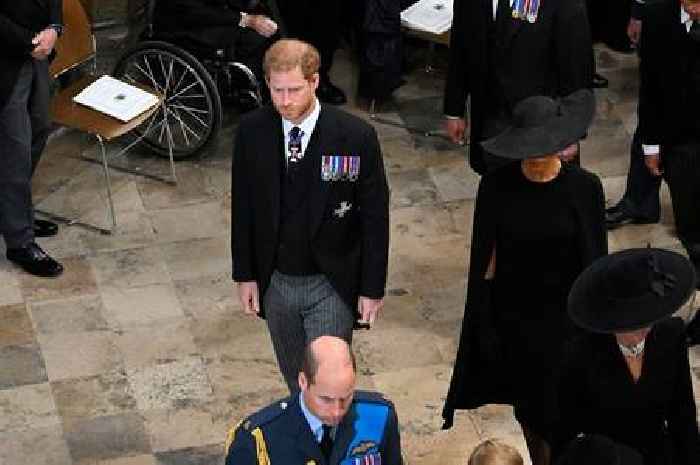 Prince Harry 'consoled' by Meghan Markle after 'regretful glance' at William during Queen's funeral