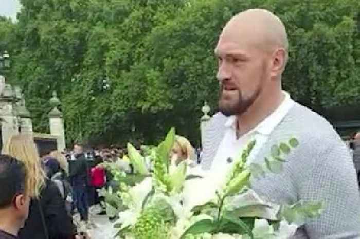 Tyson Fury lays flowers at Buckingham Palace before the Queen's funeral