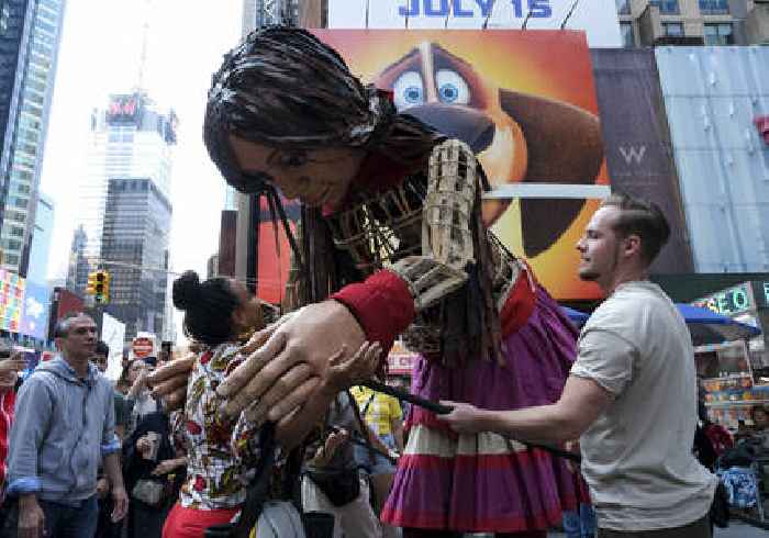 In Times Square, a 12-foot-tall Syrian 'immigrant' named Little Amal receives a warm welcome