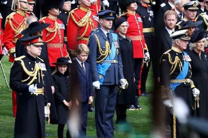 Princess Charlotte reminds George of royal protocol as they stand next to Queen's coffin