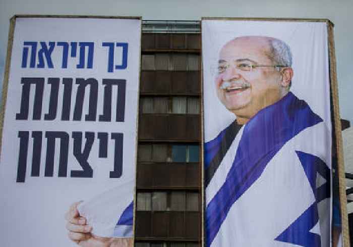 Billboards depict MKs Ahmed Tibi and Ayman Odeh wrapped in Israeli flags