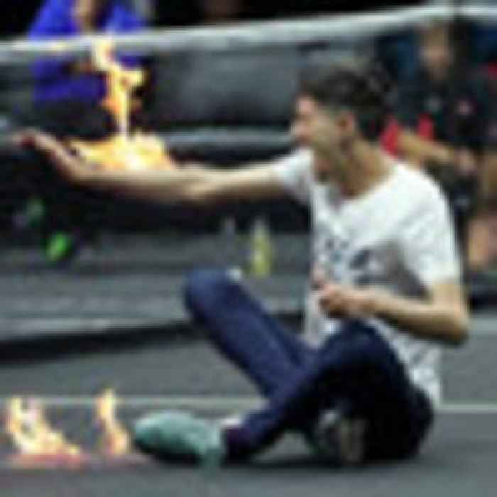 Tennis: Climate protester sets arm on fire on court ahead of Roger Federer's farewell at Laver Cup