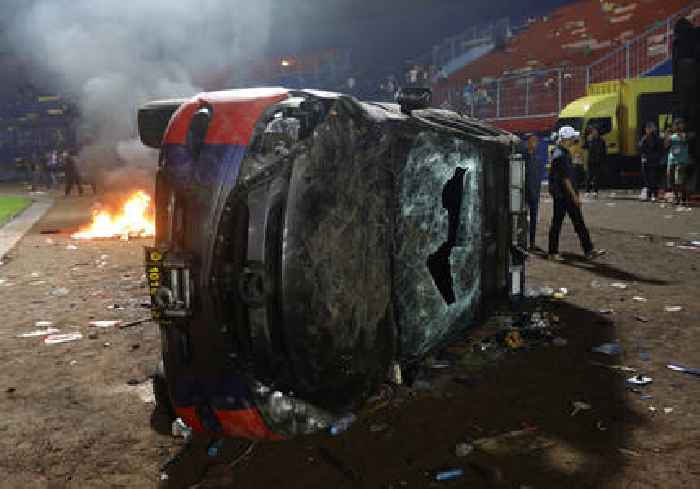 Indonesia police say 129 people killed after stampede at football match