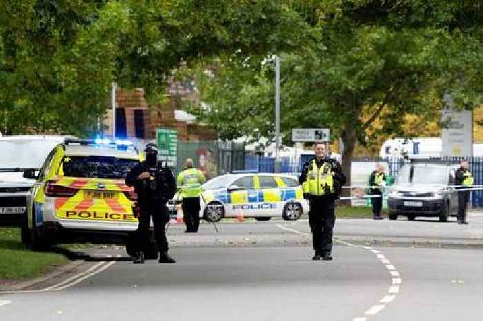 Man shot dead by armed officers in police station car park