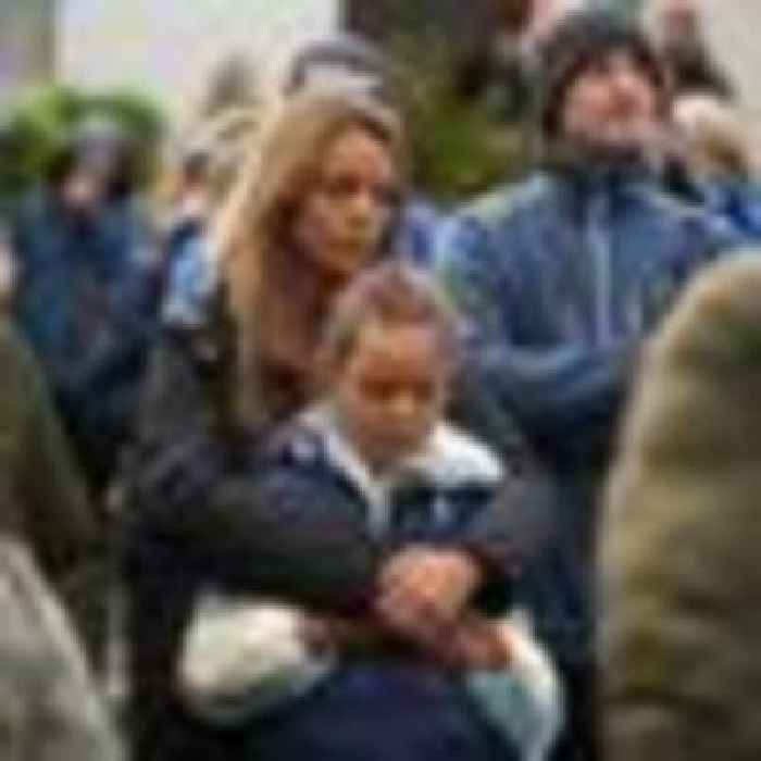 Parents hug children at vigil for 10 people killed in Ireland petrol station explosion