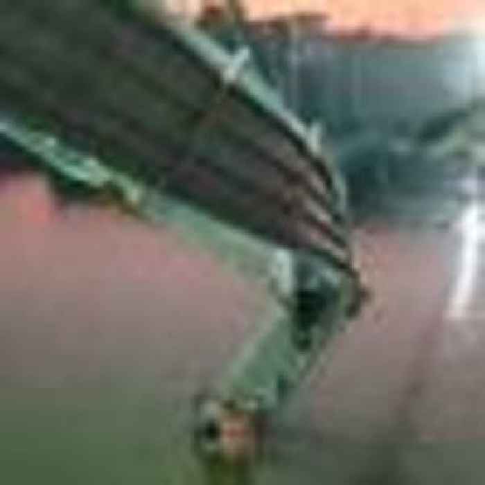 Suspension bridge collapses in India, plunging hundreds into river