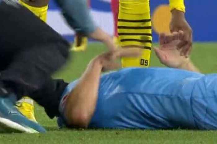 Footballer goes down injured - and gets brutally kicked in the head by his own physio