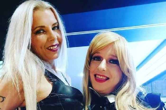 Woman supporting cross-dressing partner by doing hair and make-up together