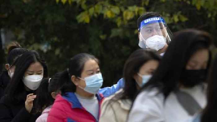 China Eases Some Quarantine For Travelers Even As Cases Rise