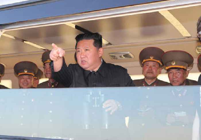 North Korea's Kim reveals daughter at ballistic missile test