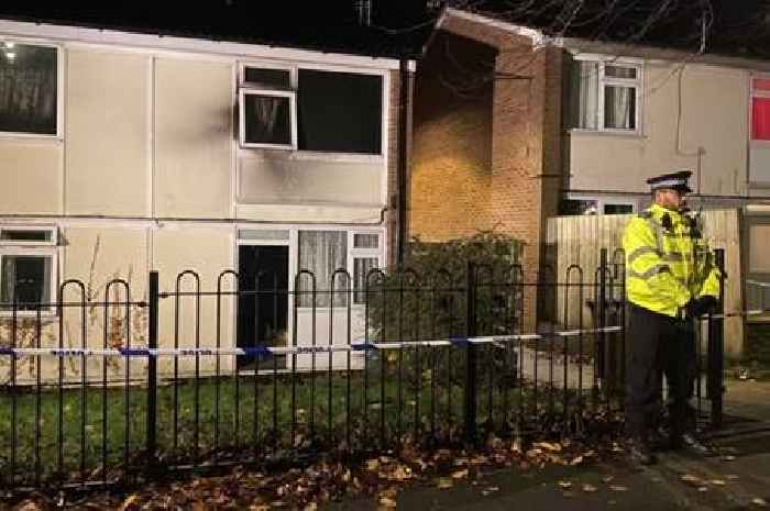 Man arrested on suspicion of murder after young girls die in flat fire