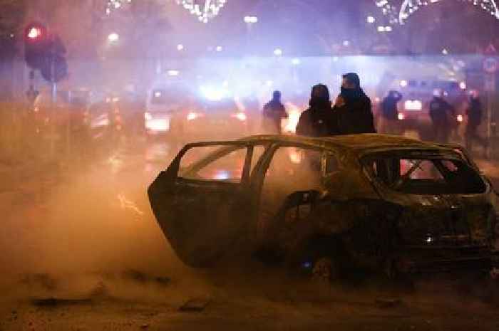 Rampaging fans burn cars in Brussels as cops use tear gas after Belgium lose at World Cup