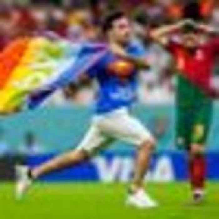 Protester carrying rainbow flag invades pitch during World Cup game
