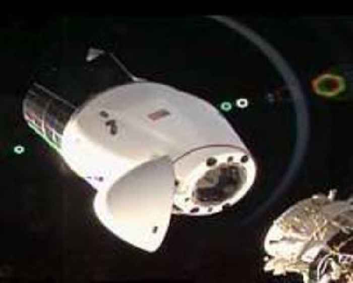 SpaceX resupply cargo capsule docks with International Space Station