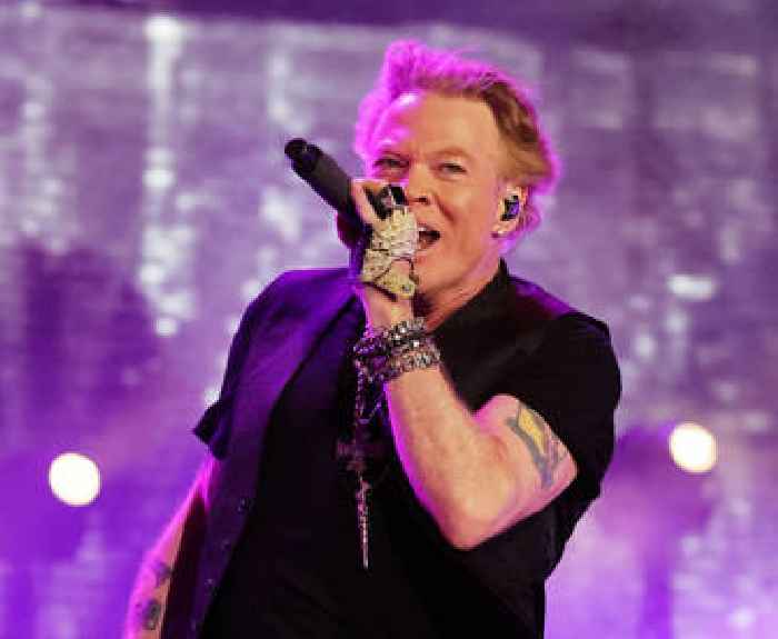 Axl Rose Says He’ll Stop Throwing Mics After Australian Woman Catches One To The Face
